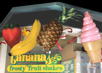 commercial signage sculptures including strawberry, banana, pineapple, and ice cream