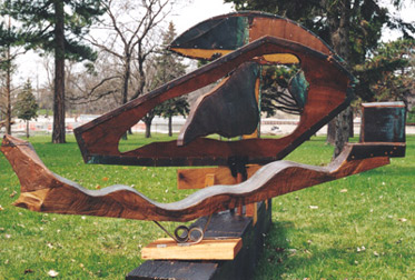 front view of 3 piece copper and wood sculpture by Lawrence Kinney (for Forest Lawn Cemetery 150th Anniversary Celebration)
