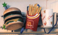sculptures of fast food burger, french fries in a box and drink with straw